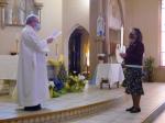 Fr. Pat Forman installs newly elected Regent Loretta Schneider after mass on May 13, 2021, at St. Monica's Church, Barre.